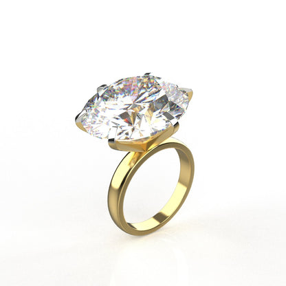 Gold ring with a large diamond on a white background